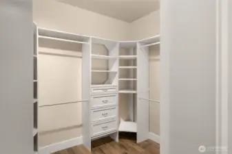Primary walk-in closet with custom shelving