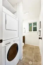 Half bathroom and laundry room on the main level great for guests - washer and dryer are included in the sale.
