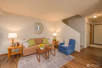 View of entry space, stairs going upstairs and possible living room.