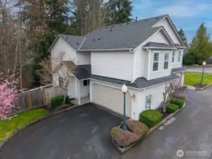 Lots of parking with guest spots on the other side the of flowering pink tree. Home faces Northwest.