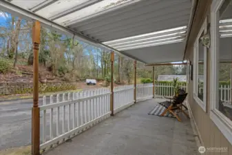 Enjoy your coffee on the front porch and watch for deer to come by from the treed lot behind you.