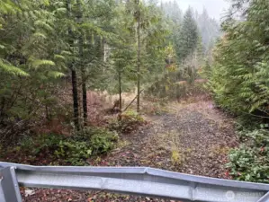 Level building site past gate.