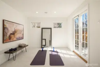 Lower level room perfect for a workout space with French doors taking you outside for some fresh air.