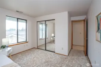 3rd bedroom upstairs, with mirror sliding closet doors