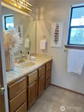 upstairs bathroom sink, cabinet and mirror