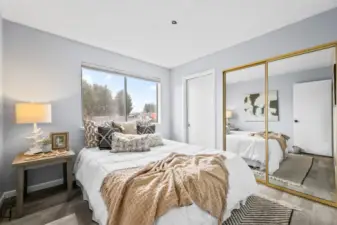 The secondary bedroom offers flexible space — perfect as a guest room or larger home office.