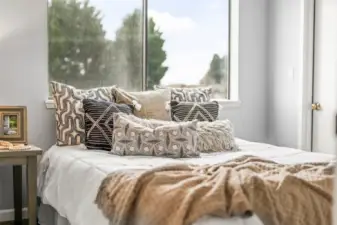The Secondary bedroom features ample closet space and direct access to the deck off the kitchen, where you can enjoy views of the Narrows.