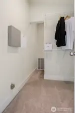 Primary walk-in closet has bonus storage space.