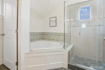 Primary bath has deep soaking/jetted tub and sperate ceramic shower & South facing window.