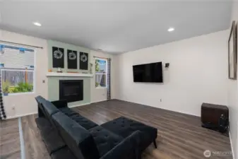Great room living space with gas fireplace.