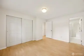 Closet space and primary bath shown here.