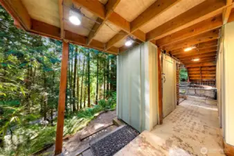 Covered patio with plenty of storage for garden and yard tools.