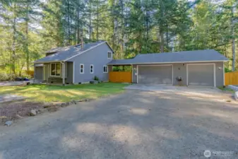 Detached three car garage plus plenty of driveway parking space.