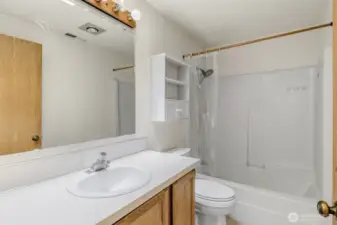 Full bathroom on upper level with shower/tub combo.