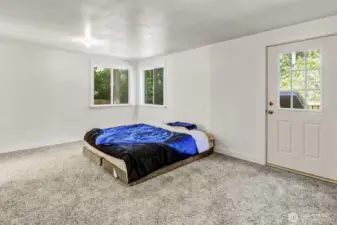 Attached garage has been converted into additional living space: bedroom with walk-in closet and roughed-in bathroom.