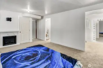 Another view of the converted garage showing the gas fireplace.
