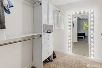 Walk-in closet with built-ins on both side - so much storage space!