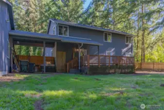 Breezeway leads to the detached garage with workshop space.