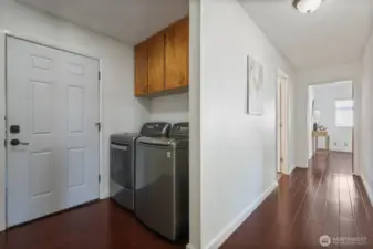 Laundry and mud room open to backyard. Washer and dryer included.