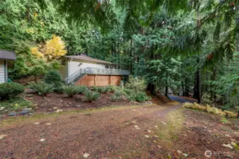 Long sloping driveway gives privacy on this .45 Acre lot.
