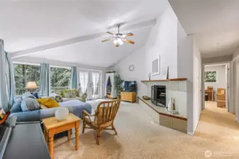 Full living area view with hall to bathroom and bedrooms on right.