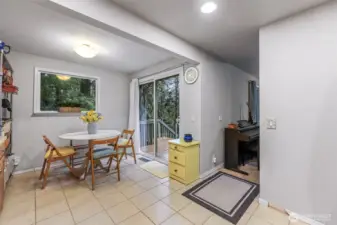 Door to private side deck and entry to living room.