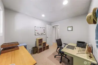 Middle bedroom currently serving as an office.