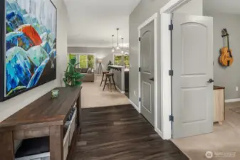 Clean lines, soft hues, and natural light guide your eye toward the open living space.