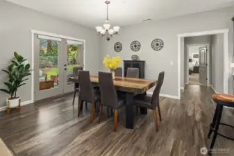 This elegant dining space offers the perfect backdrop for memorable meals — seamlessly extending to the outdoor patio for effortless entertaining year-round.