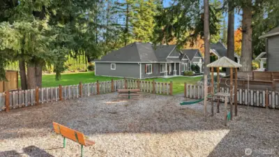 A charming neighborhood playground sits just steps away, offering a welcoming space for play, laughter, and community connection.