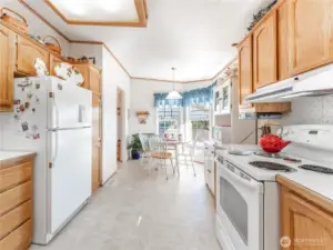 Bright kitchen featuring new appliances and ample cabinet space