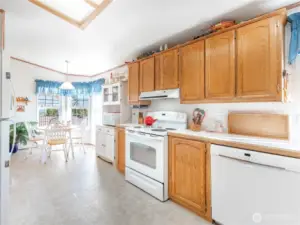 Bright kitchen featuring new appliances and ample cabinet space