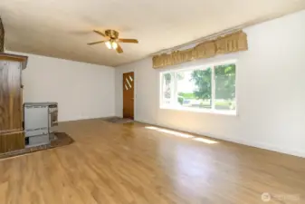 Step inside and you're welcomed into a warm and inviting living area that instantly feels like home.