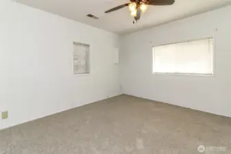 The first bedroom offers a comfortable and versatile space.