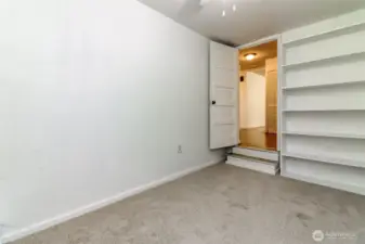 The third room features shelving adding extra storage of organization options.