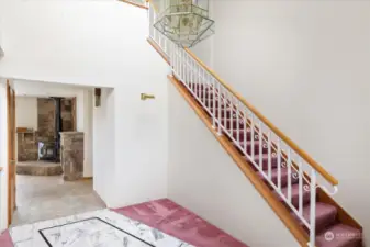 Formal entry looking into family Room and up stairs