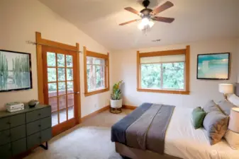 Primary bedroom with deck off front of unit -  - Virtually Staged