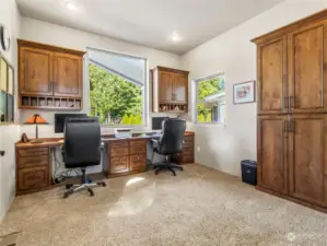 Large home office with custom built-ins.