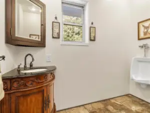 Hallway guest bath with toilet and urinal!