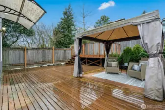 Fully fenced yard with newer deck and gazebo with sitting area - perfect for sitting outside and relaxing!