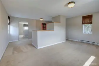 Upper bedroom with walk-in closet and balcony.