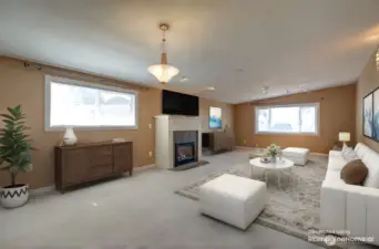 Family room with gas fireplace, virtually staged