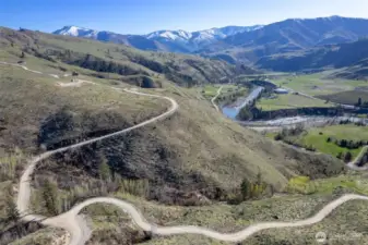 Cowboy road delivers you to the fertile beauty of lower build site or elevated you to high view setting.