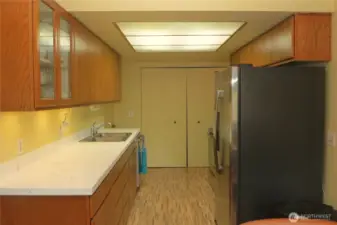 GALLEY KITCHEN HAS GREAT COUNTER TOPS AND IS USER FRIENDLY!  THERE IS PLENTY OF STORAGE IN THESE CABINETS!