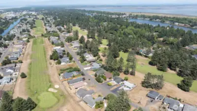 AERIAL OF THE OTHER GREENS AND FAIRWAYS TOWARD DOWNTOWN OCEAN SHORES! TO THE LEFT IS THE GRAND CANAL! TO THE RIGHT IS DUCK LAKE AND THEN THE BAY!