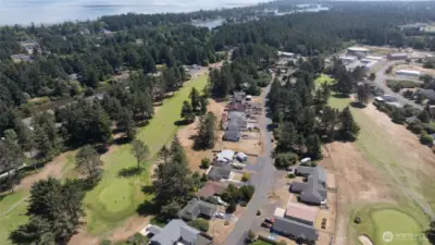 AERIAL VIEW OF HOMES AND FAIRWAY! SOUTH WEST VIEW OF DUCK LAKE AND BAY IN THE BACK GROUND!