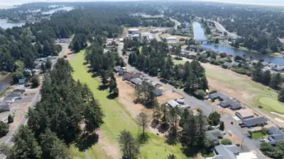 AERIAL SOUTH SHOWING THE FAIRWAY WITH DUCK LAKE AND ISLANDS TO THE LEFT!  TO THE RIGHT IS THE GRAND CANAL AND OCEAN LAKE WAY BRIDGE FOR ACCESS TO THE BEACHES!