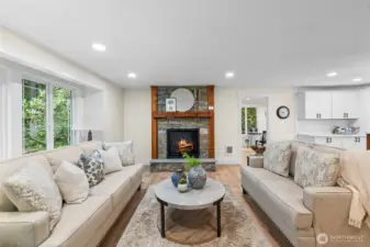 Great room features new propane fireplace with beautiful stonework, hearth and mantel.  Perfect for cozy fall nights!