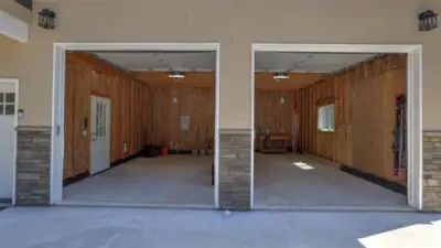 Ideal level driveway with tons of parking including this spacious garage with 9' doors.