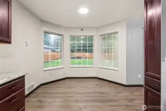 Cozy eating nook conveniently located directly off the kitchen, providing an inviting space for casual meals and everyday gatherings.